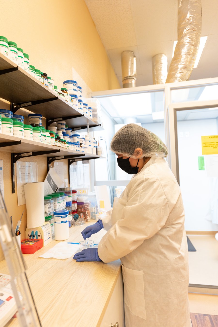 Compounding workstation with PPE at TFC Pharmacy