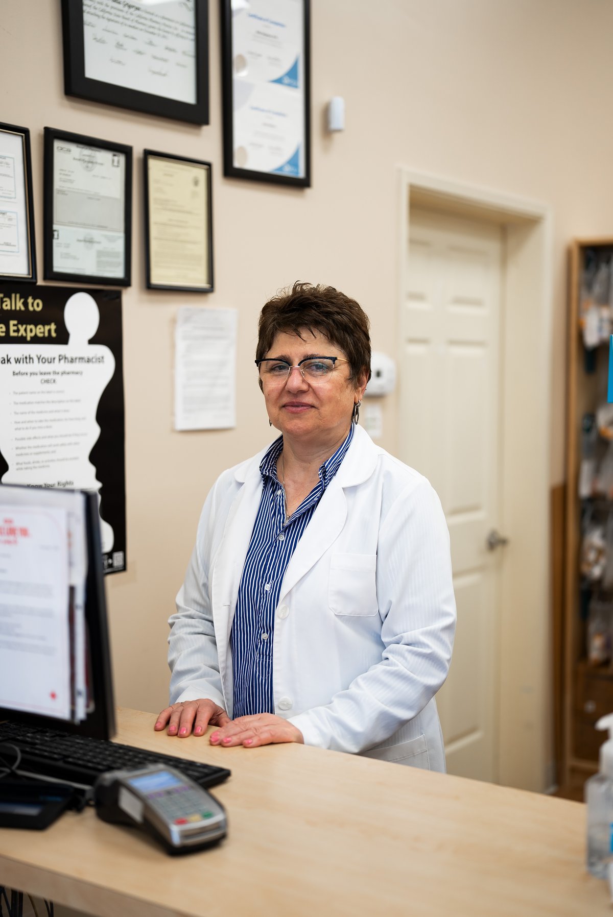 TFC pharmacist at the prescription counter